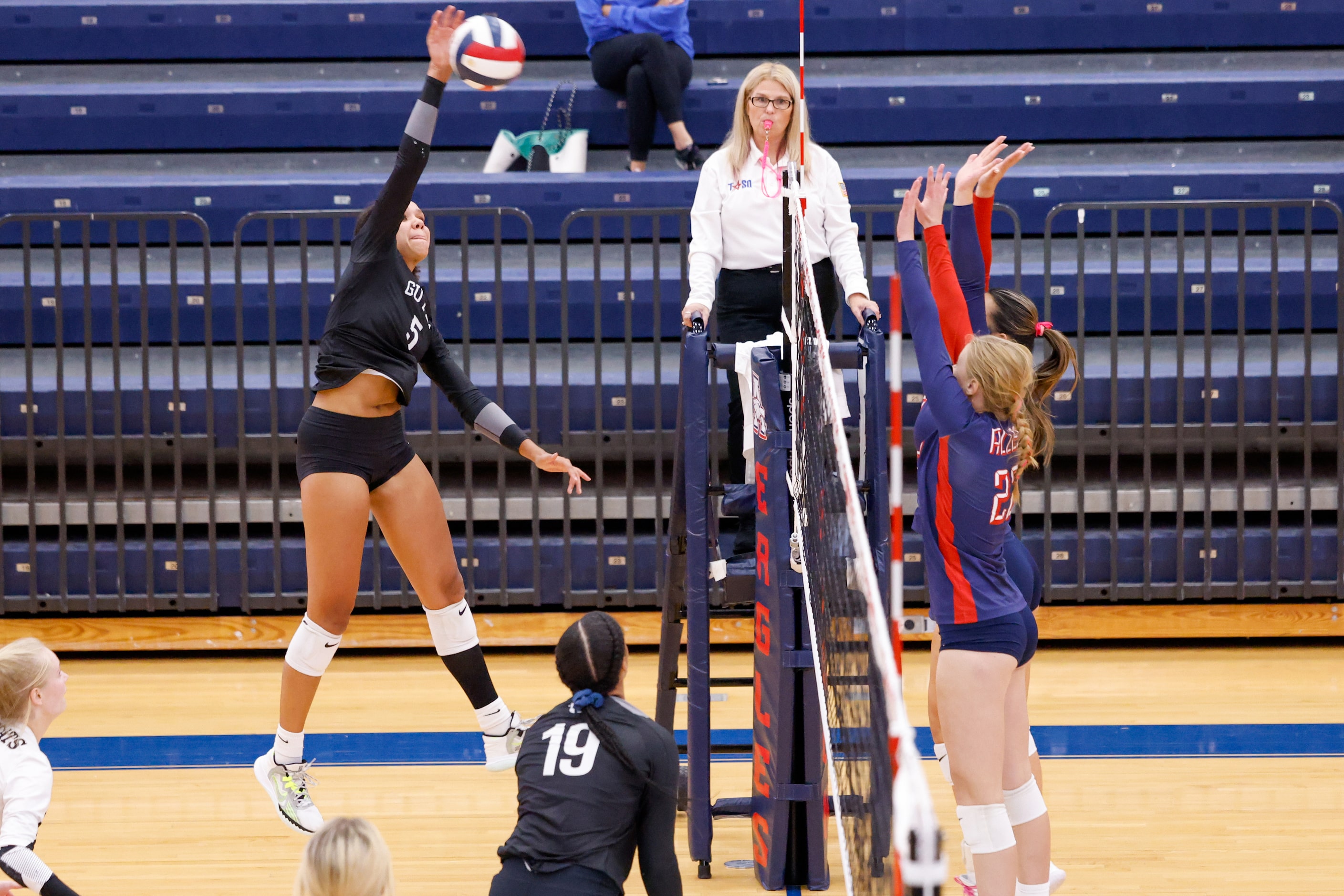 Denton Guyer senior Kyndal Stowers (5) makes contact with the ball, sending it over the net...