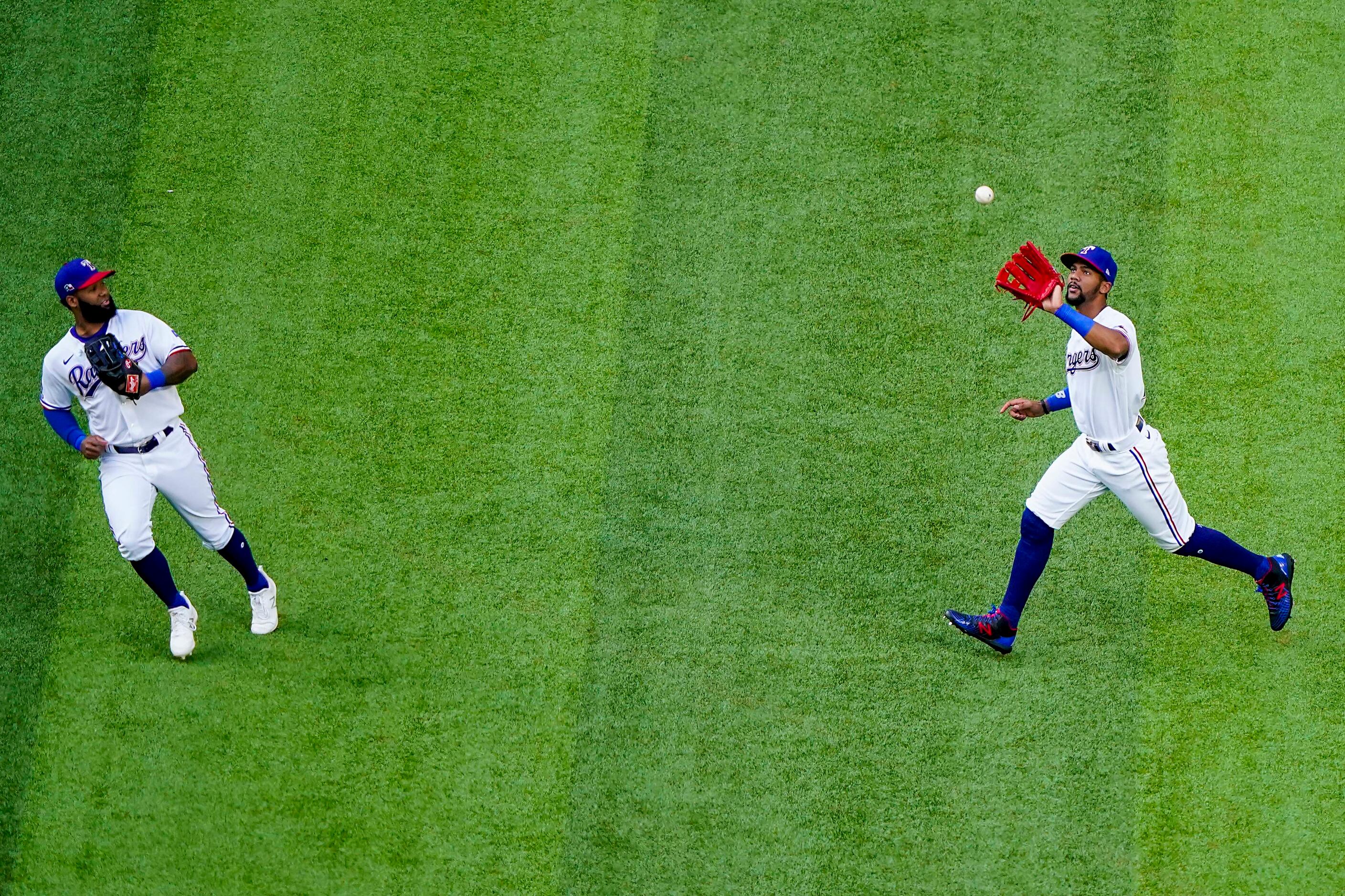 Right fielder Leody Taveras makes a catch on a fly ball off the bat of Rougned Odor as Danny...