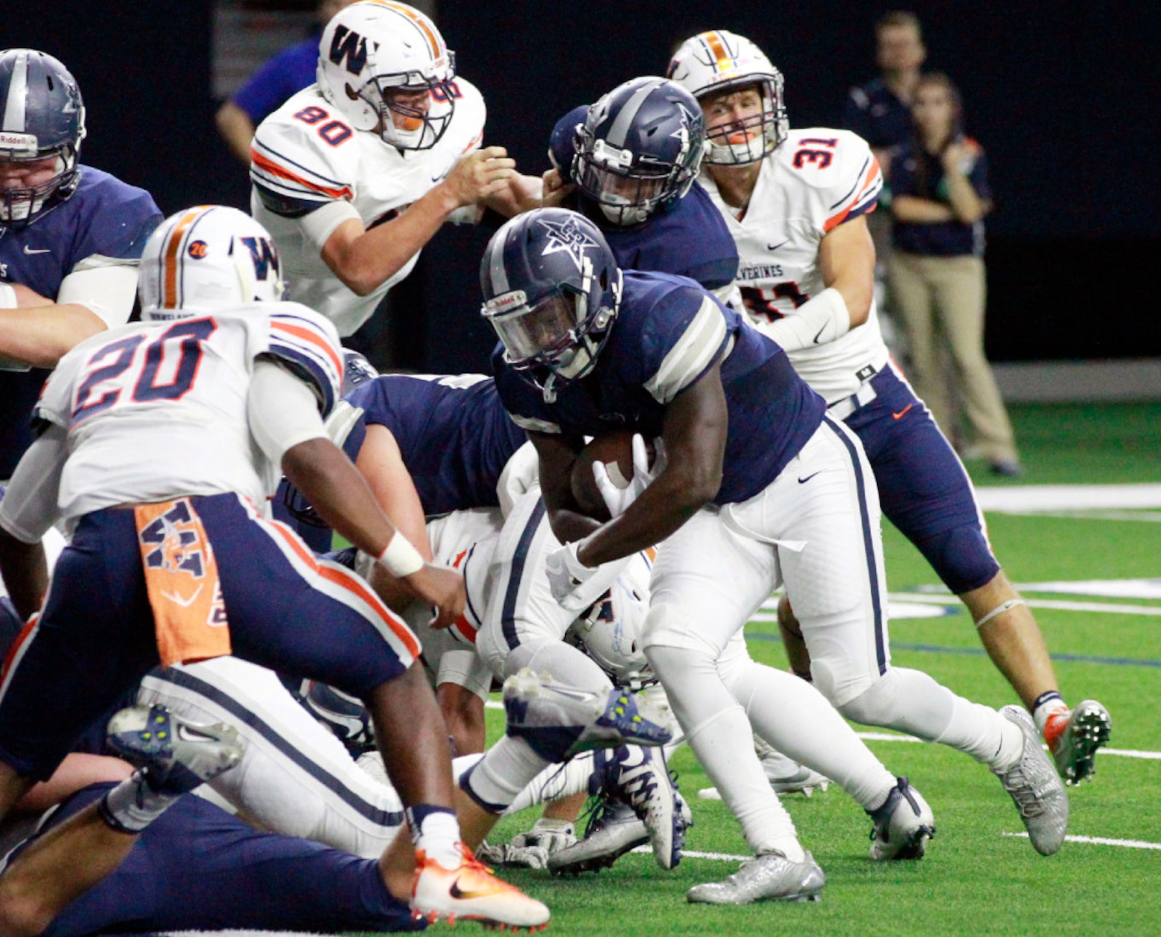 Frisco Lone Star High's  Darrin Smith (4) heads  through Lakeland High defender Torrance...