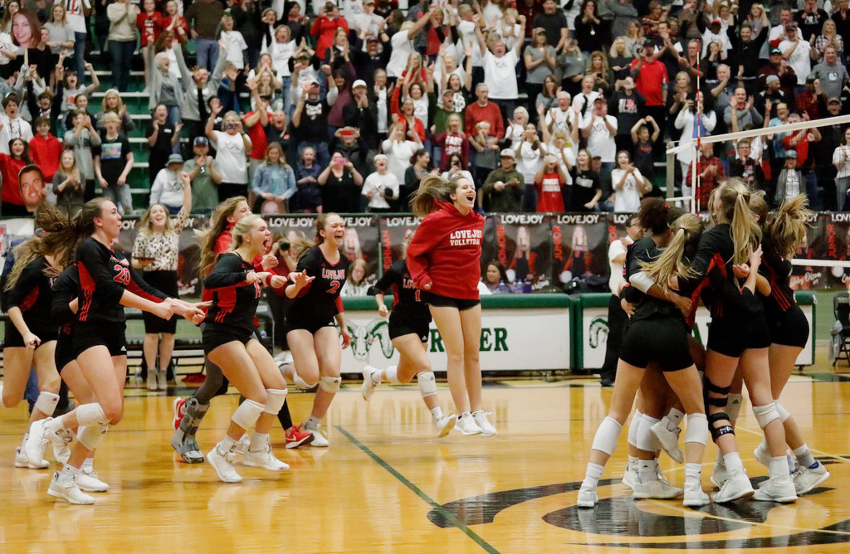 The Lovejoy High School bench rushes the team on the floor after completing a sweep in game...