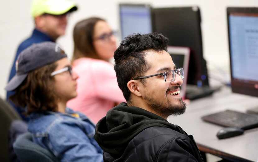 Student Robert Gallegos reacts to Super Bowl ad Thursday in the Integrated Marketing...
