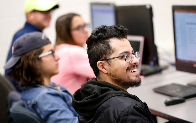 Student Robert Gallegos reacts to Super Bowl ad Thursday in the Integrated Marketing...