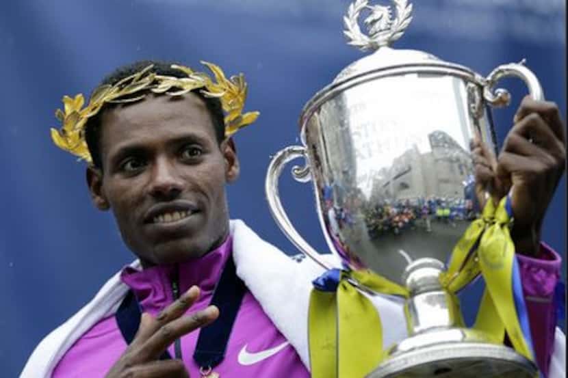 Lelisa Desisa holds his trophy after winning Monday's Boston Marathon (Elise Amendola/AP Photo)