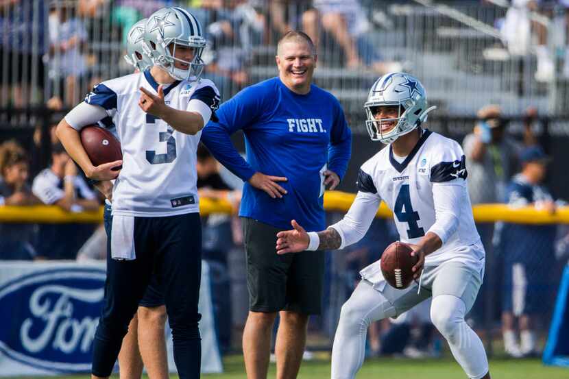 Dallas Cowboys quarterback Mike White (3) jokes with quarterback Dak Prescott (4) during an...
