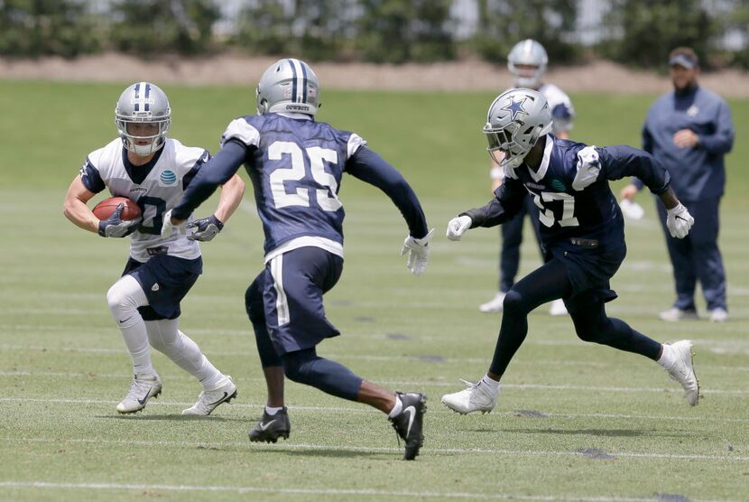 In this photo taken June 13, 2017, Dallas Cowboys receiver Ryan Switzer (10) runs with ball...