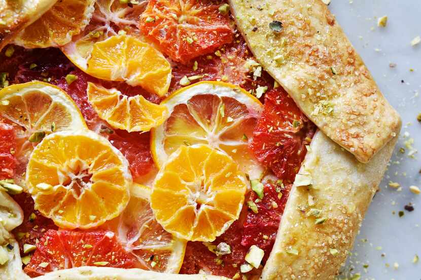 Rustic citrus galette made with pie dough, ricotta filling, blood orange, grapefruit,...