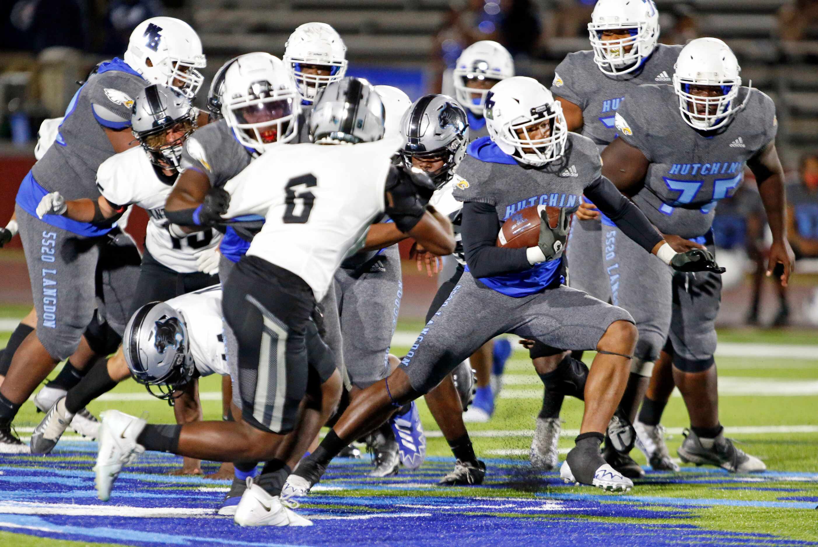 Wilmer-Hutchins William Stephens (8) picks up a couple of yards through heavy traffic during...