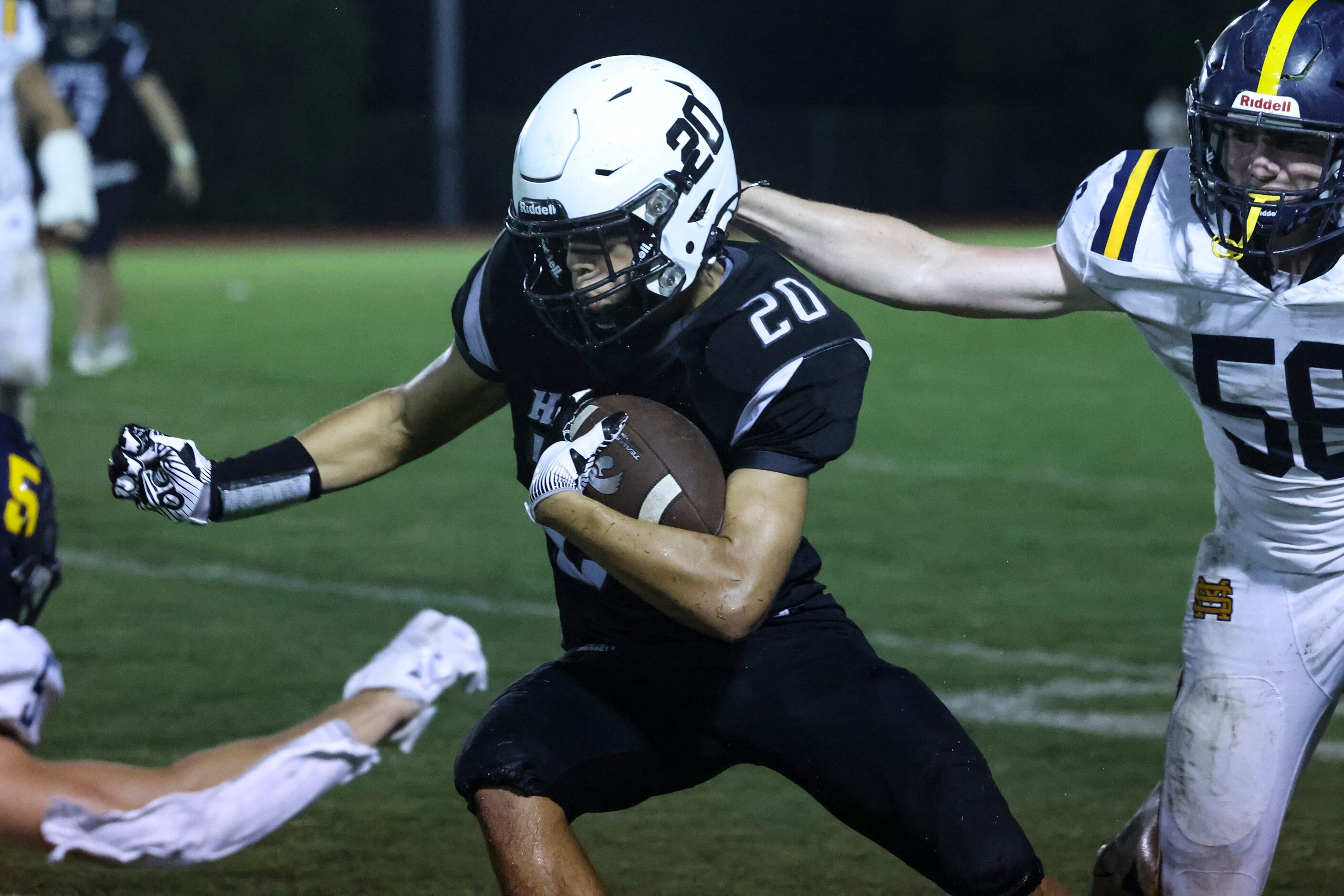 Cistercian Preparatory School Michael Peterman (20) dodges St. Mark's School of Texas...