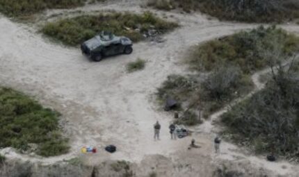  Members of the Texas National Guard patrol along the Rio Grande at the Texas-Mexico border...