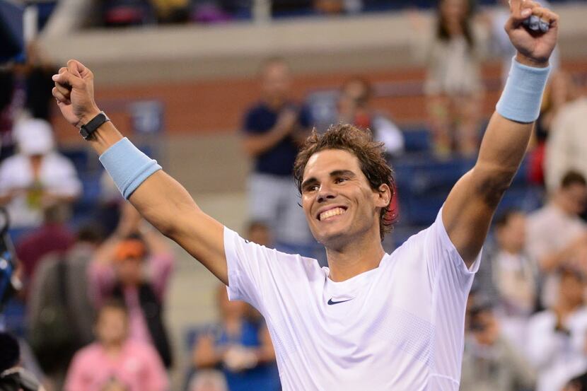Spanish tennis player Rafael Nadal celebrates defeating France's Richard Gasquet in the 2013...