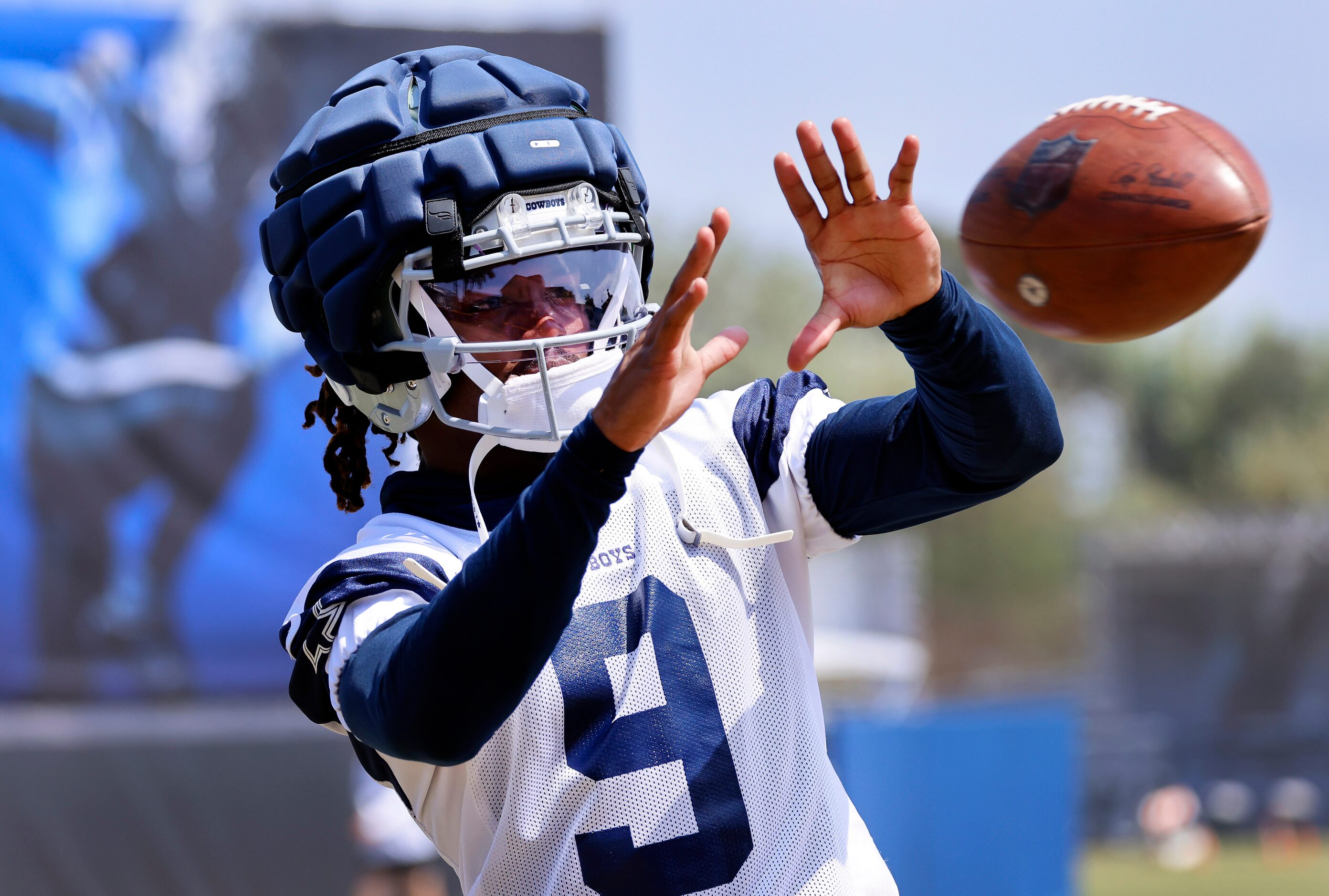 Dallas Cowboys wide receiver KaVontae Turpin (9) catches passes off the throwing machine...