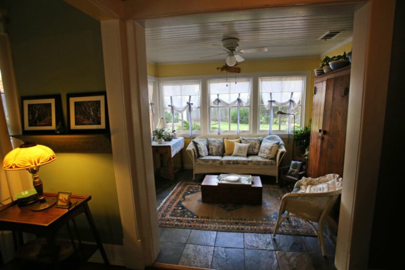 The sun room of Jackie and Doug Sweat's home on Junius Street in Munger Place  on Tuesday,...