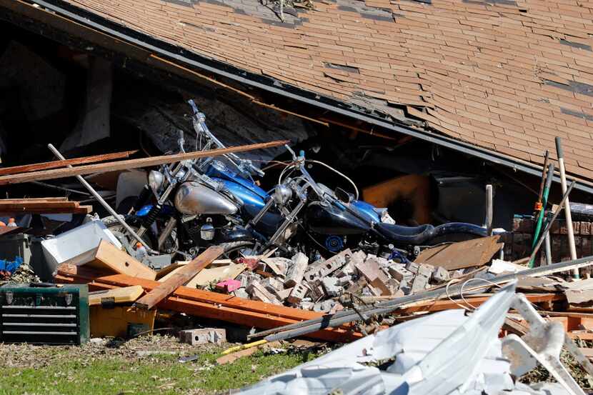 Bo and Britney Carroll's garage collapsed after tornadoes passed through Emory, Texas on...