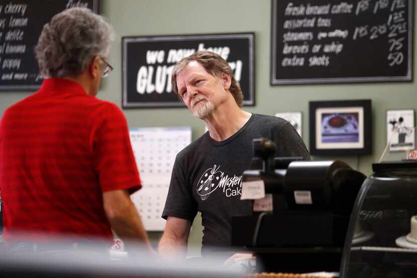 Baker Jack Phillips, owner of Masterpiece Cakeshop, right, at his shop Monday, June 4, 2018,...