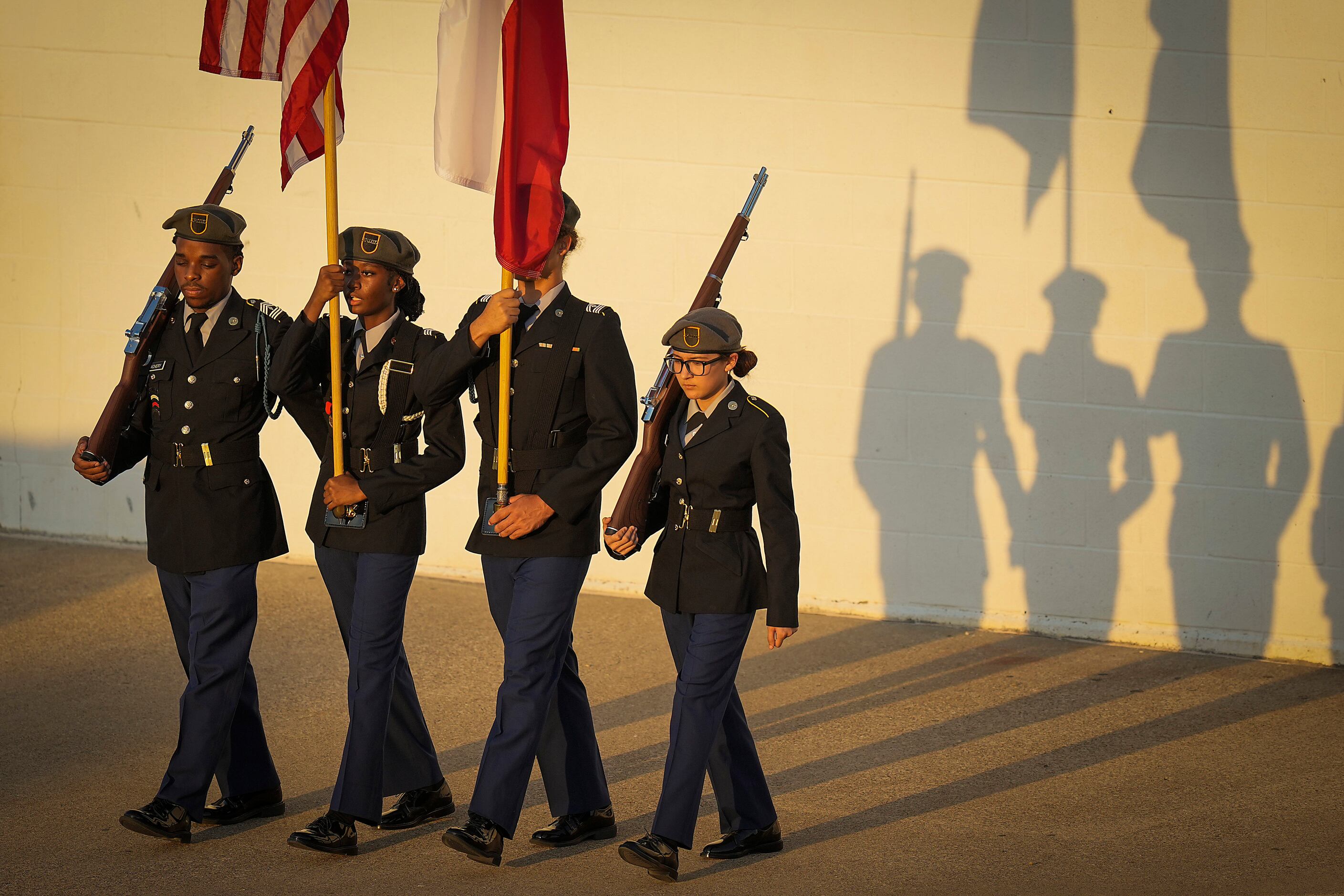 The color guard takes the field before a high school football game between DeSoto and...