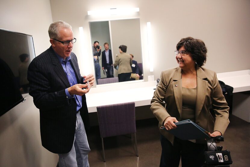 Longtime television reporter Brett Shipp (left) speaks with Dallas County sheriff Lupe...