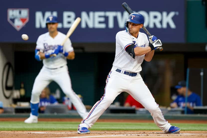 Texas Rangers shortstop Corey Seager (5) eyes a pitch during the first inning of a MLB game...