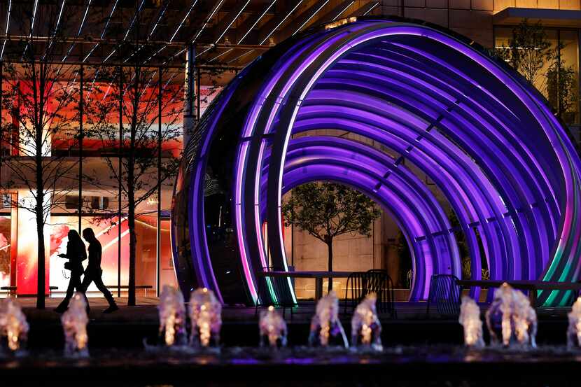 The 30 ft. tall LED-lit Globe (right) is pictured at dusk in the new AT&T Discovery District...