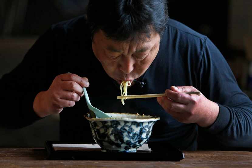 Chef Teiichi Sakurai demonstrates how to eat ramen, at the restaurant Ten at Sylvan 30 in...