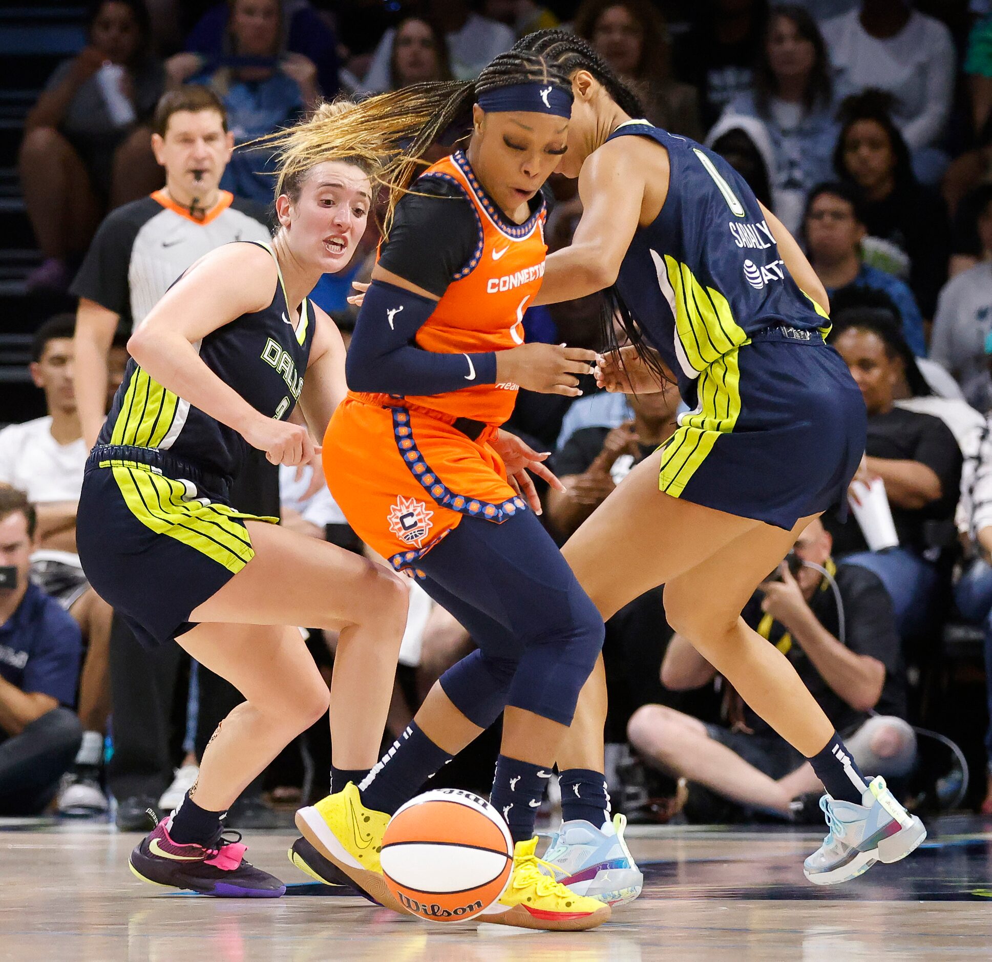 Dallas Wings guard Marina Mabrey (3) turns the ball over to Connecticut Sun guard Odyssey...