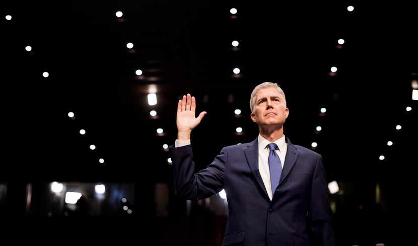 Neil Gorsuch, President Donald Trump's nominee for the Supreme Court, is sworn in Monday on...