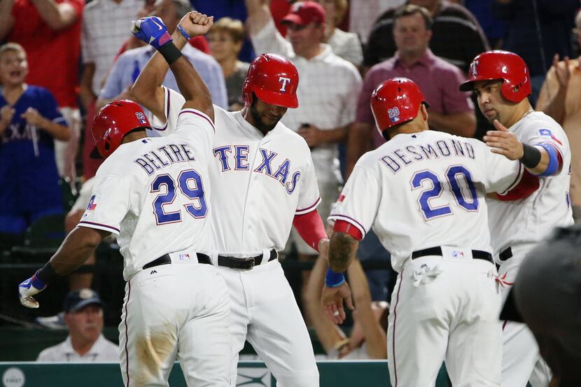 Texas Rangers third baseman Adrian Beltre (29) celebrates with pinch runner Nomar Mazara...
