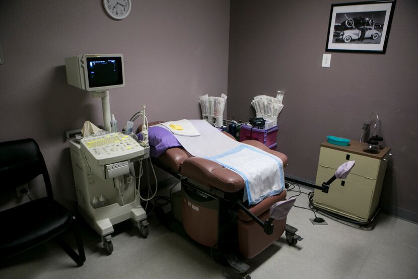An ultrasound machine and exam table inside a room at Whole Woman's Health in Fort Worth.