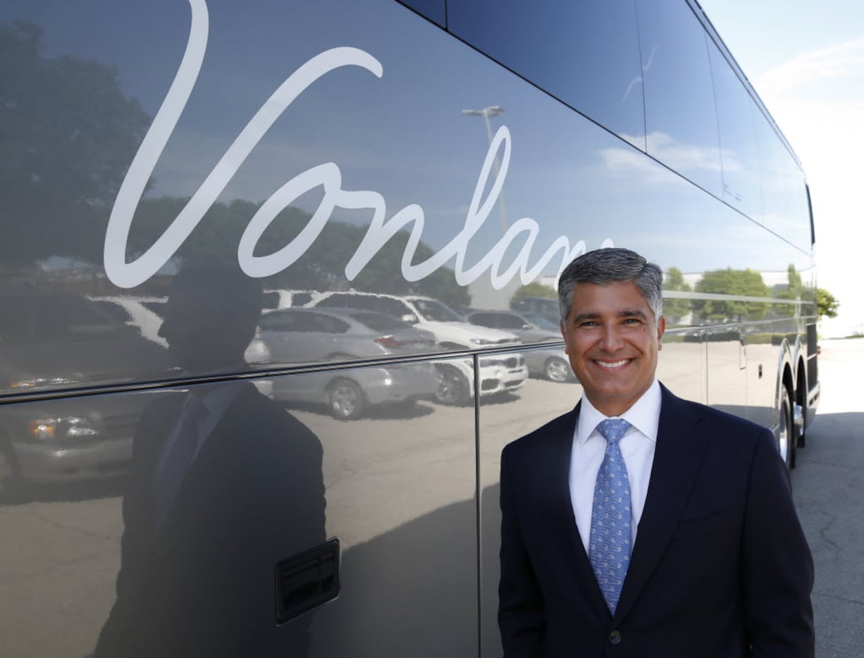 Alex Danza, Founder, President and CEO of Vonlane, stands next to one of his new buses on...