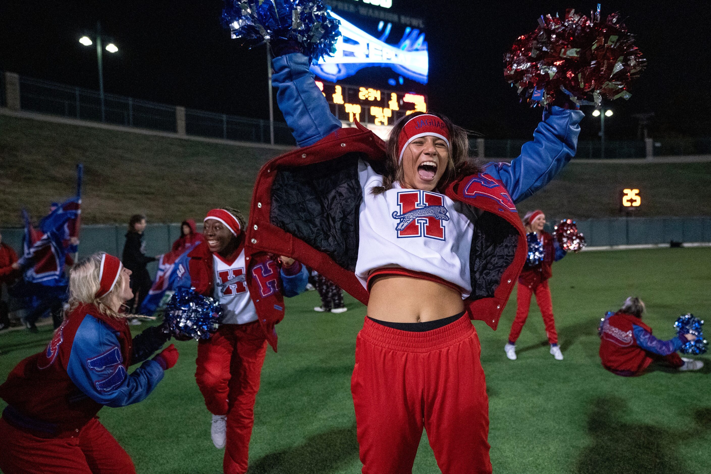 Midlothian Heritage sophomore cheerleader Vanessa Fajardo cheers during the second half of a...