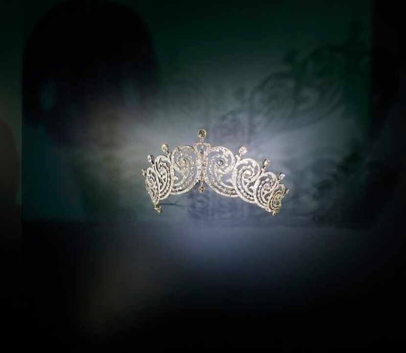 
Darkness surrounds a case containing a silver, gold and diamond tiara made on special order...