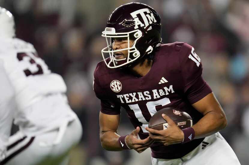 Texas A&M quarterback Jaylen Henderson rushes for a first down against Mississippi State...