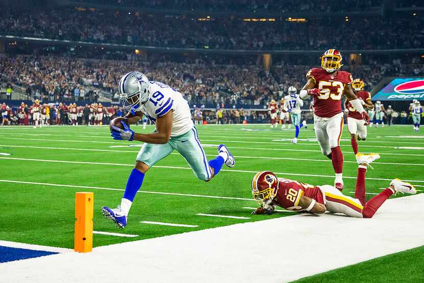 Dallas Cowboys wide receiver Amari Cooper (19) scores past Washington Redskins strong safety...