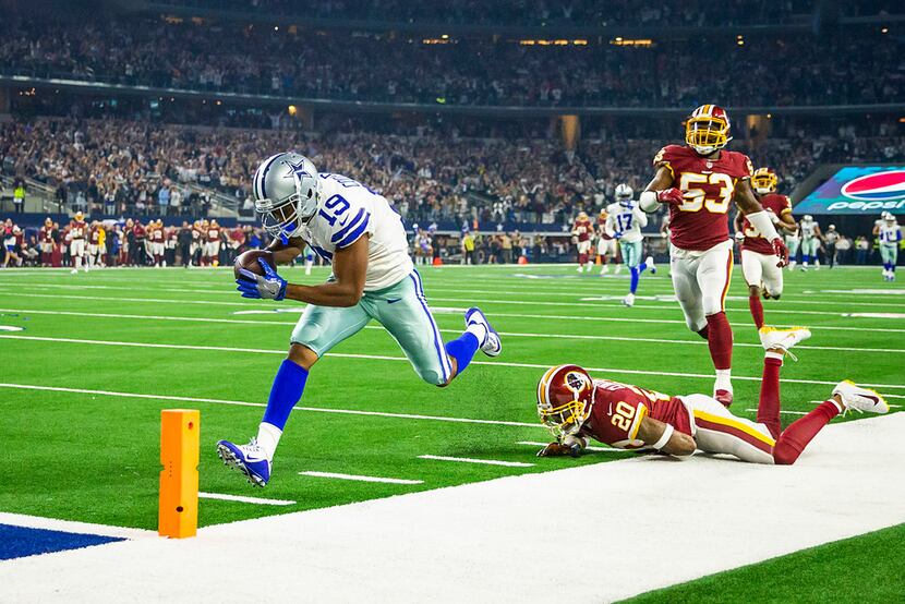 Dallas Cowboys wide receiver Amari Cooper (19) scores past Washington Redskins strong safety...