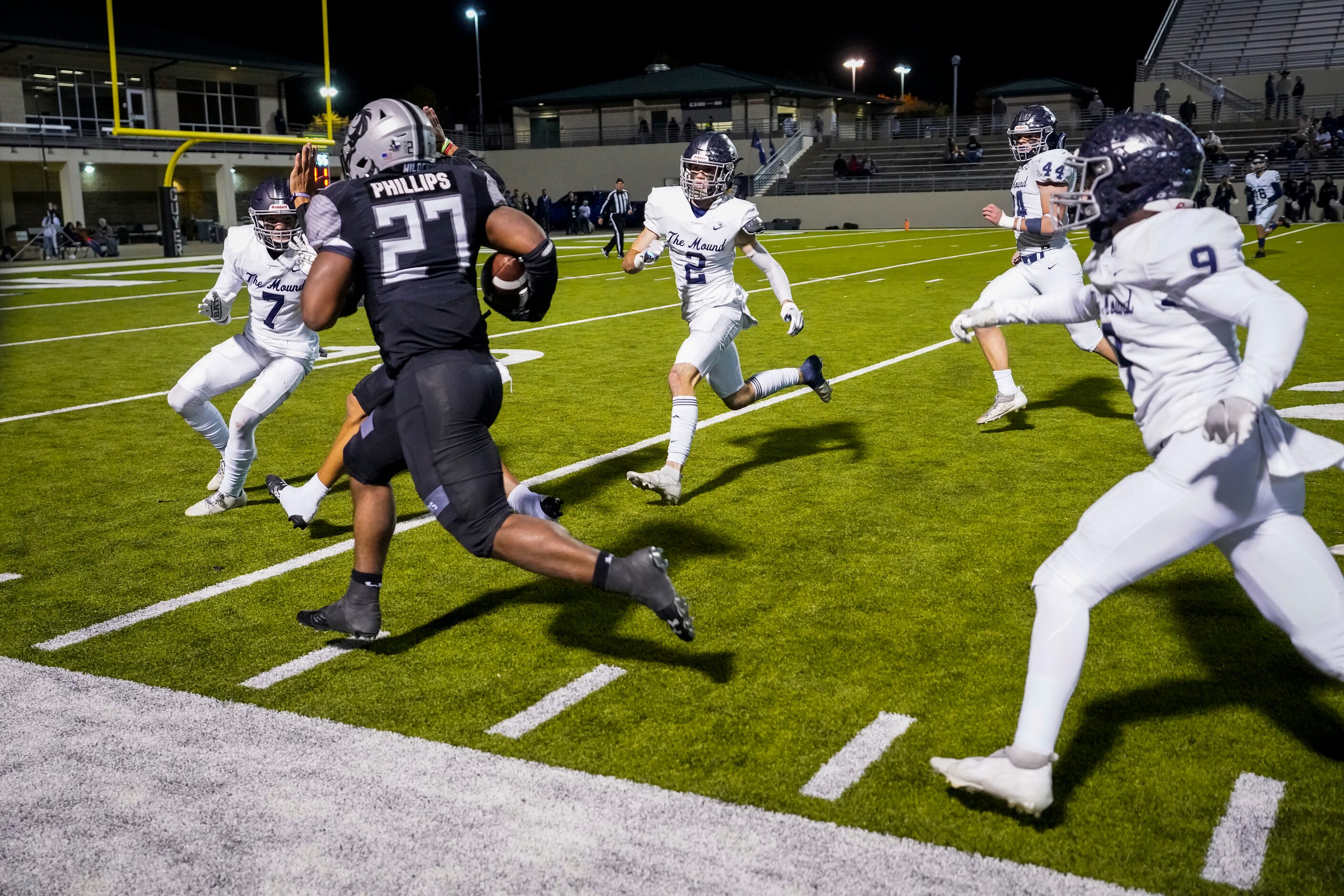 Denton Guyer running back Byron Phillips Jr. (27) races down the sidelines through the...