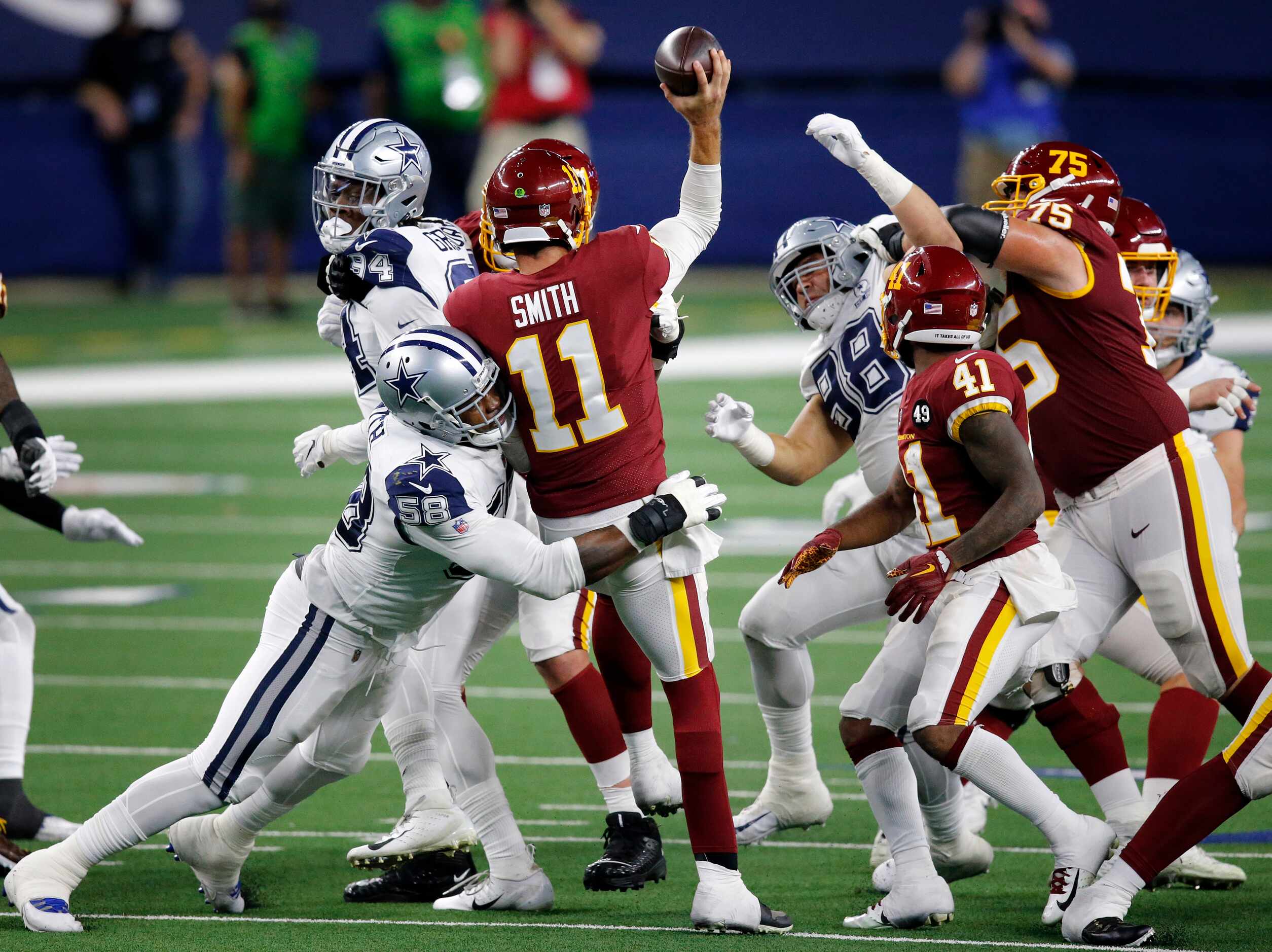 Dallas Cowboys defensive end Aldon Smith (58) forces Washington Football Team quarterback...