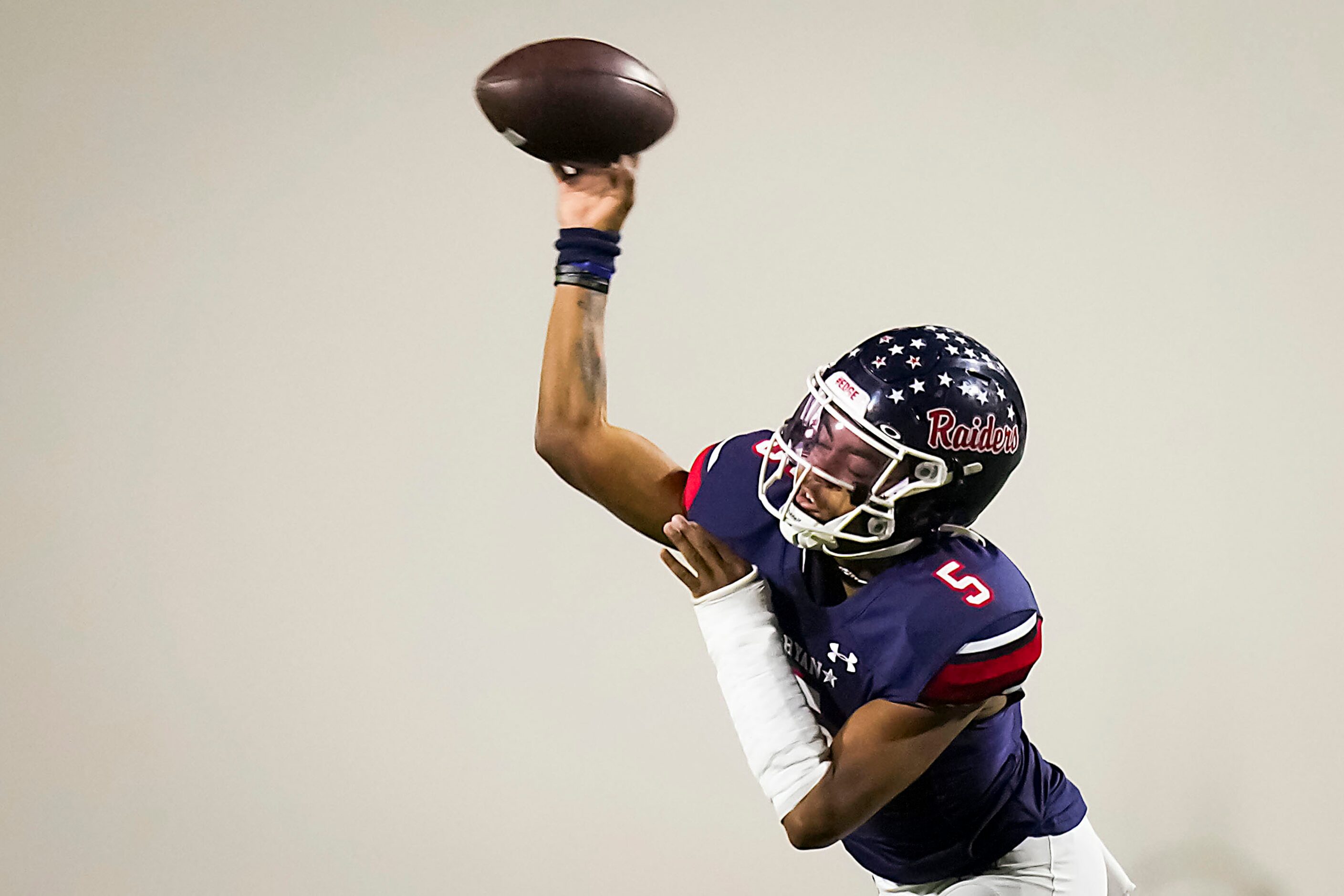 Denton Ryan quarterback Khalon Davis (5) throws a pass during the first half of a District...