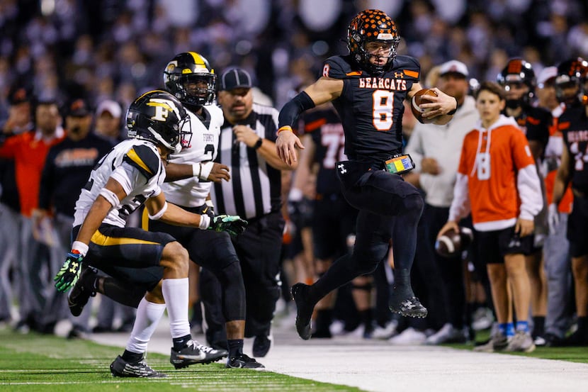 Aledo quarterback Hauss Hejny (8) jumps out of bounds to avoid Forney defensive back Joshua...