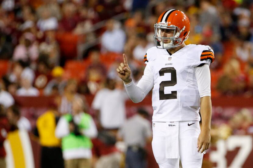 Cleveland Browns quarterback Johnny Manziel (2) holds a finger up during the first half of...