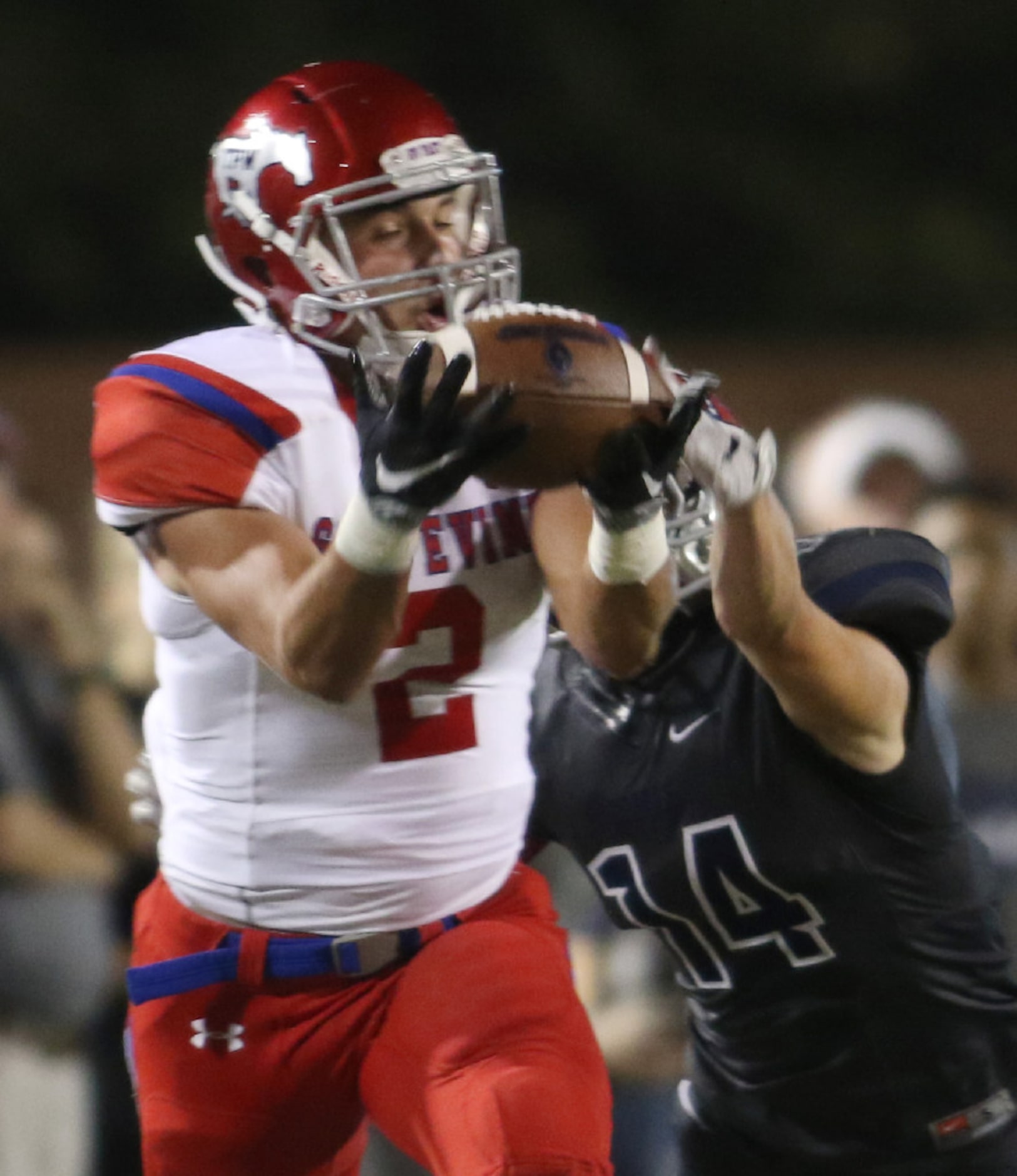 Grapevine receiver Trey Waters (2) pulls in a long reception despite the tight coverage of...