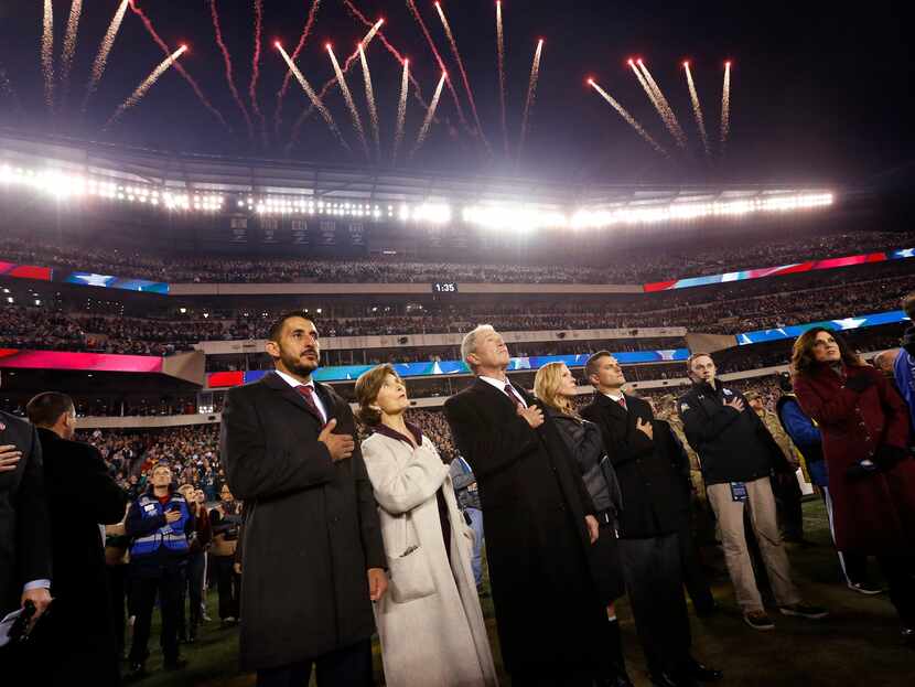 Fireworks explode over Lincoln Financial Field as former President George W. Bush and former...