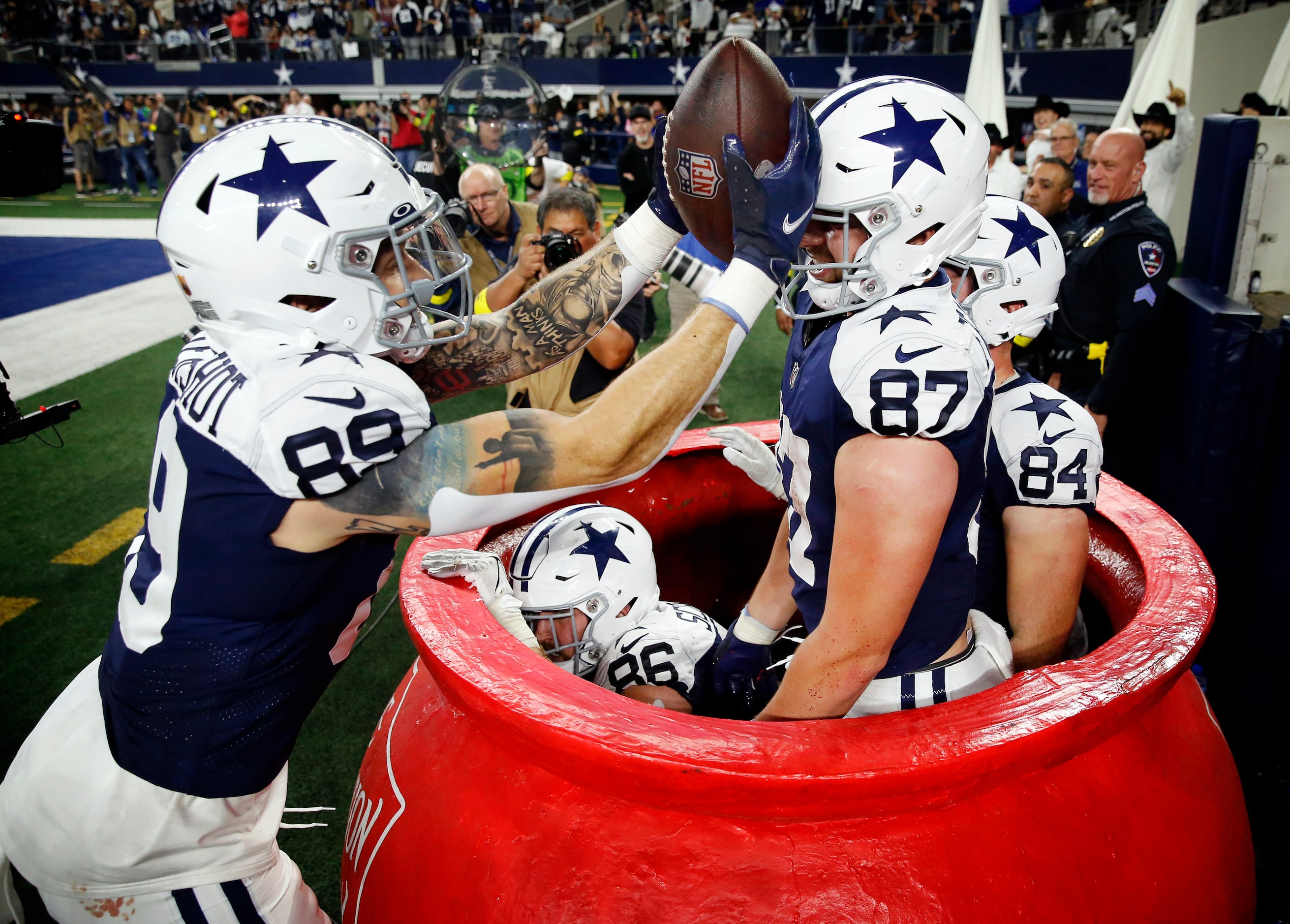 Dallas Cowboys tight end Peyton Hendershot (89) smacks Jake Ferguson (87) on the head as he...