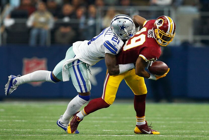 Washington Redskins wide receiver Rashad Ross (19) bobbles the ball as he is hit by Dallas...