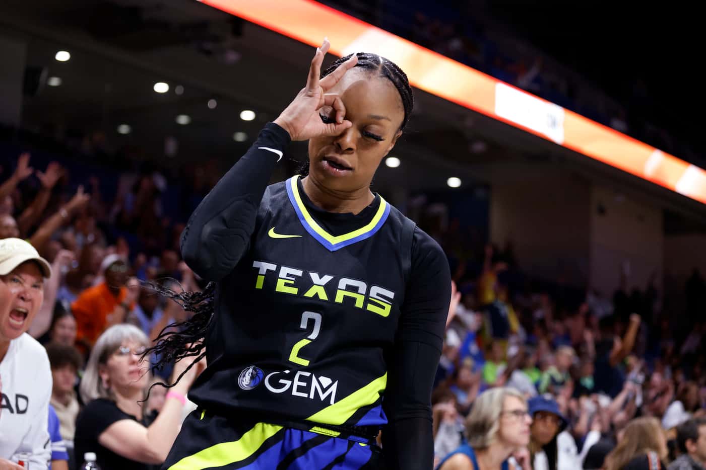 Dallas Wings guard Odyssey Sims reacts after making a 3-point shot against the Atlanta Dream...