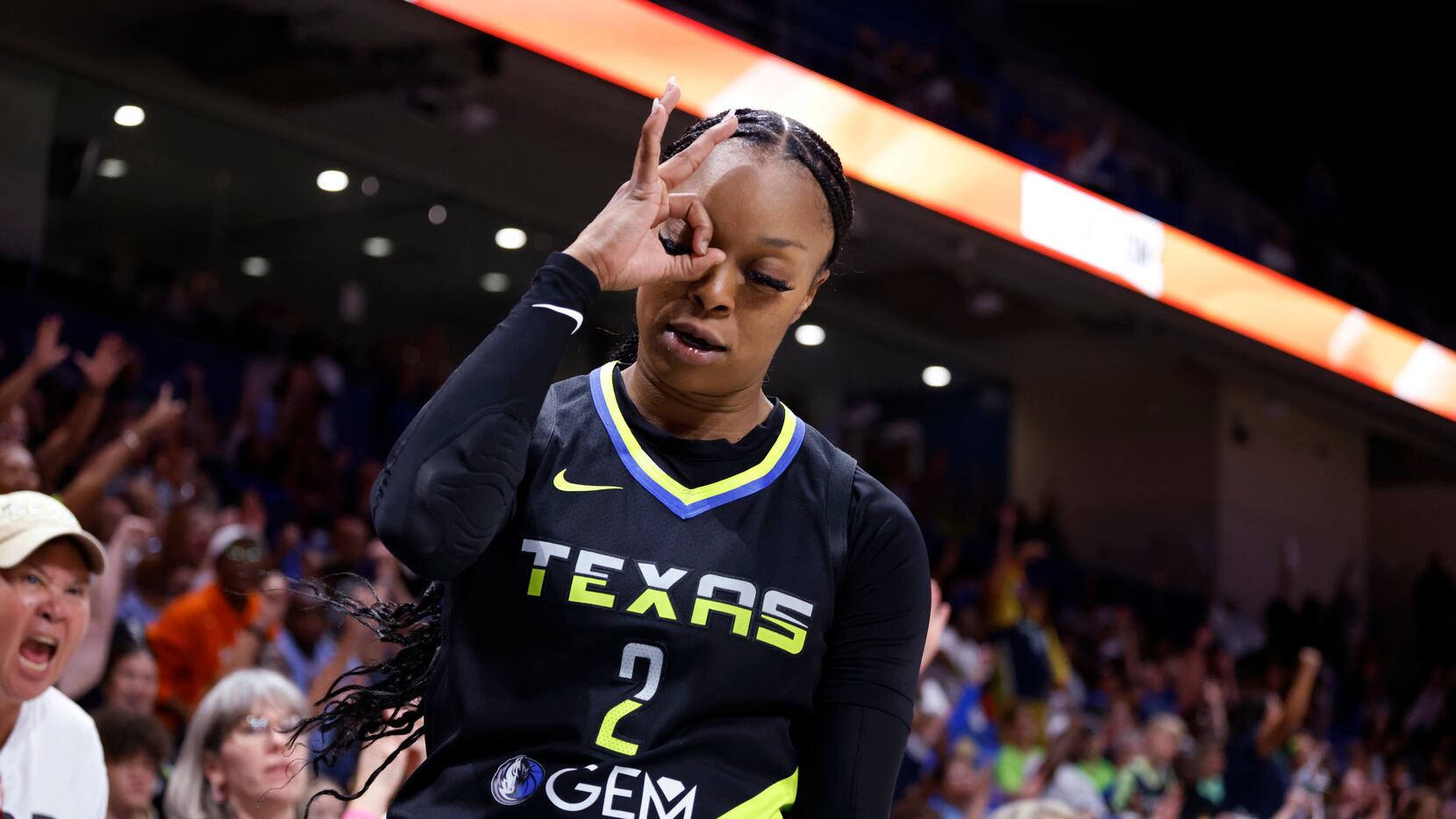 Dallas Wings guard Odyssey Sims reacts after making a 3-point shot against the Atlanta Dream...