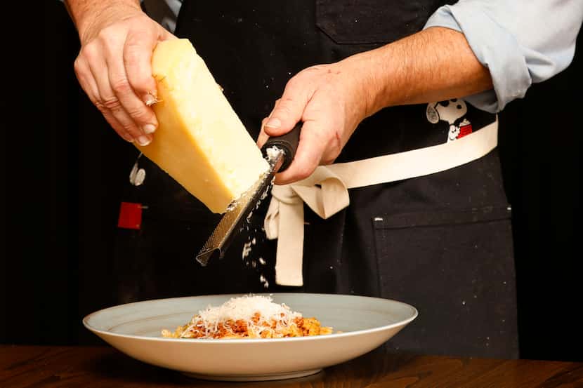 Chef John Tesar garnishes pasta at Knife Italian, his new restaurant opening at the...