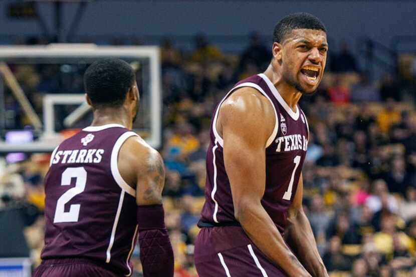 Texas A&M's Savion Flagg, right, celebrates a basket in from of teammate TJ Starks, left,...