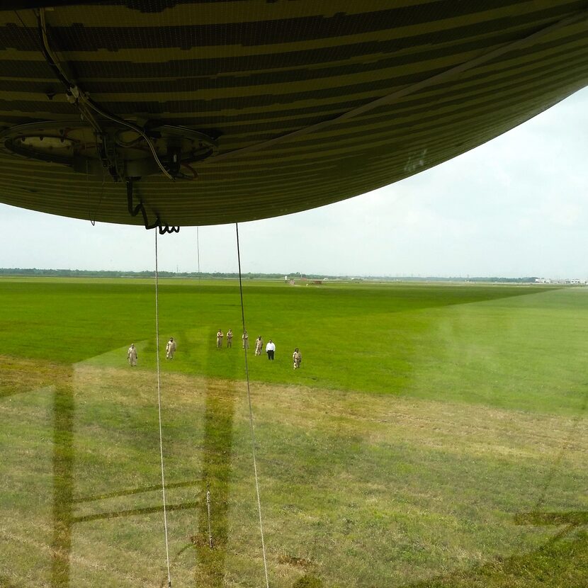 The fearless crew prepares to haul in the lumbering beast as it descends on Ellington Air...