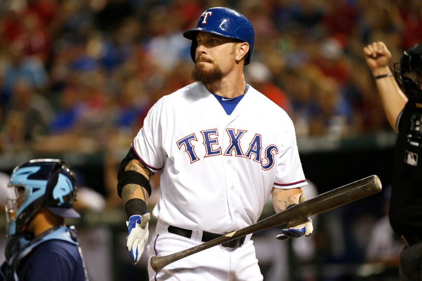 FILE - In this Aug. 15, 2015, file photo, Texas Rangers' Josh Hamilton looks away after...