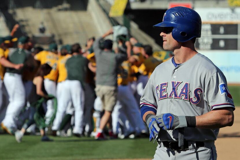  Texas center fielder Josh Hamilton throws his bat away after striking out with men on base...