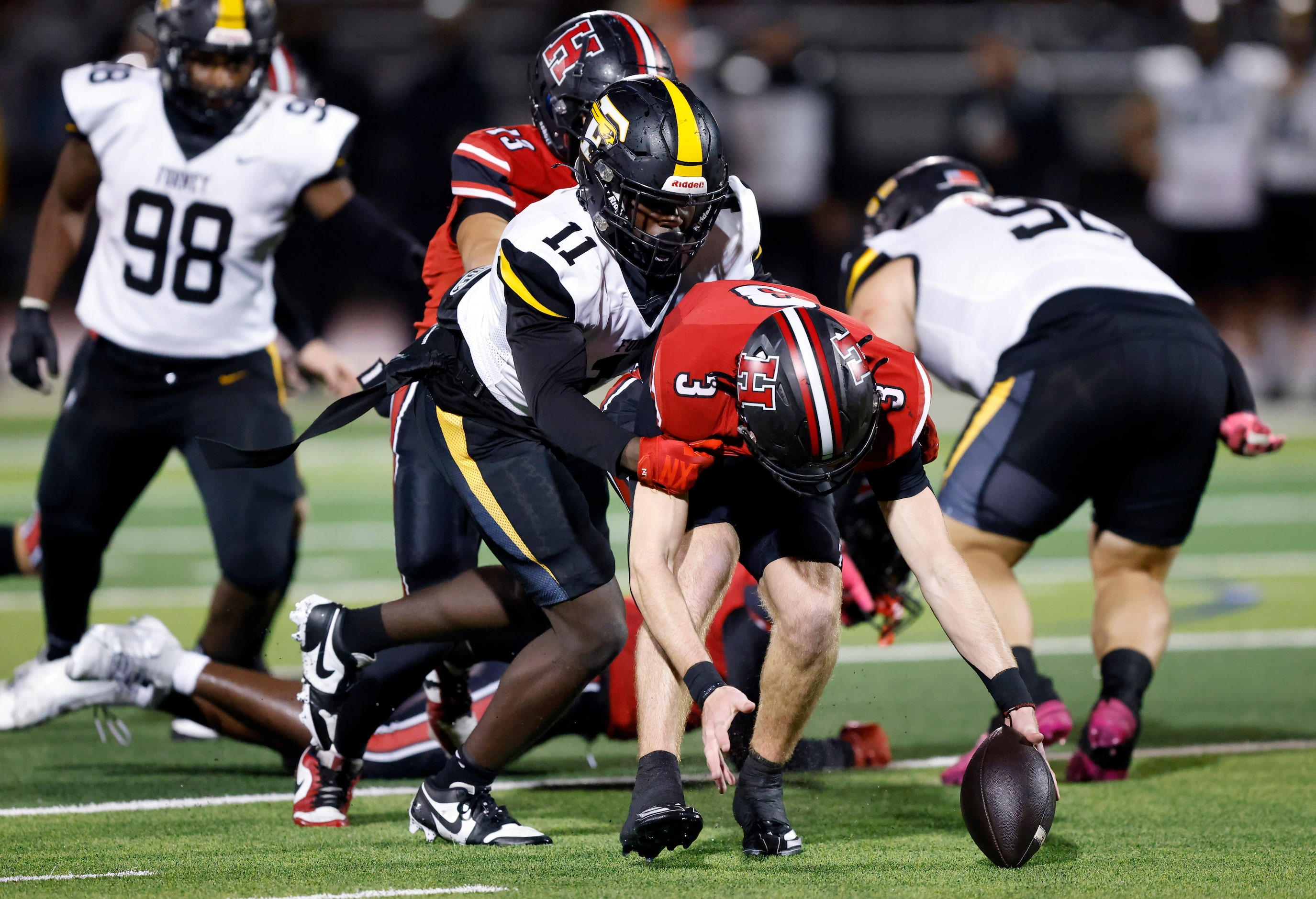 Rockwall-Heath safety Dylan McCann (3) is tackled by Forney punter Joe Jobe (11) after he...